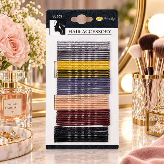 A package of 60 glittery hairpins in seven colors sits on a vanity with flowers and perfume.