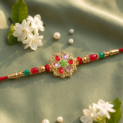 Red and Lilac Kundan Pendant Rakhi with Green Flower Centre
