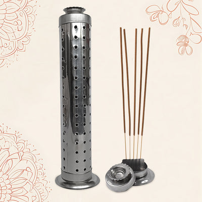 A tall, perforated stainless steel incense holder stands next to five incense sticks in a separate small holder, on a cream