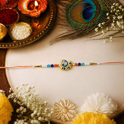 Soft thread Rakhi with peacock design