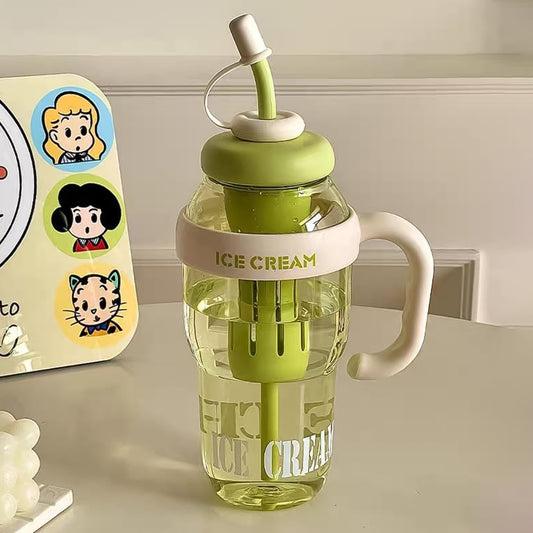 A clear plastic bottle with a green lid, straw, and handle, featuring "ICE CREAM" text.