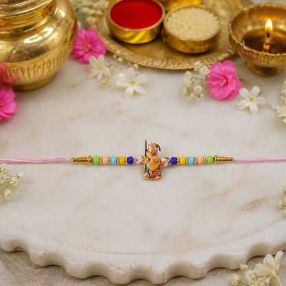Hand holding Hanuman Ji designer Rakhi showing vibrant details