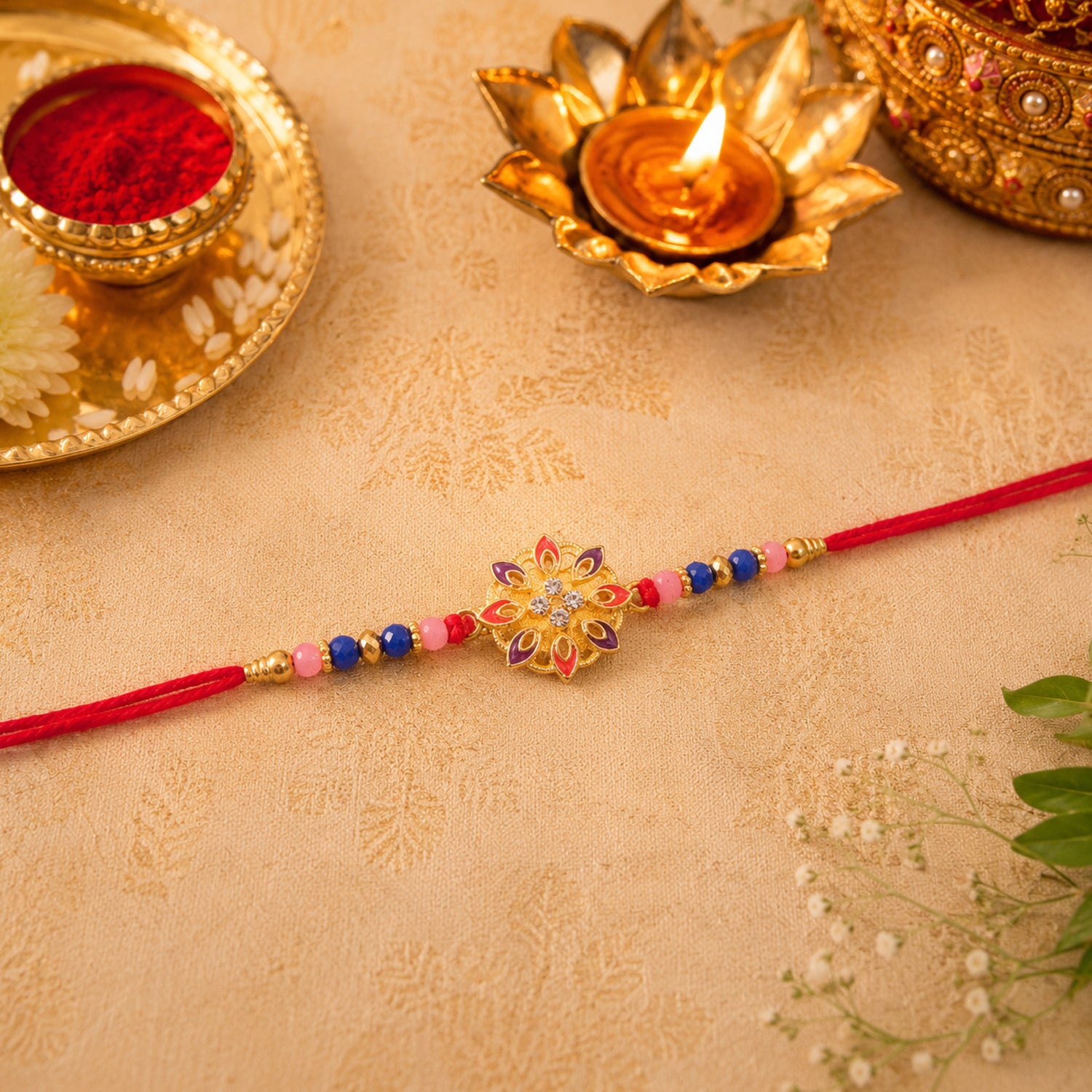 Elegant floral rakhi displayed on white surface