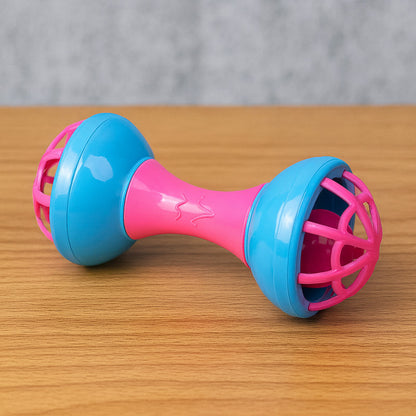 Infant holding bright musical dumbbell shaped rattle toy