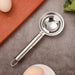 Kitchen tool for separating egg yolk and whites, stainless steel.