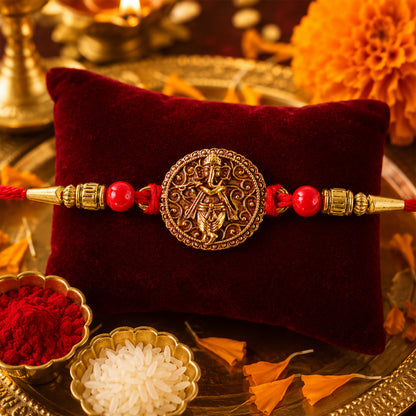 Ganesha Coin Rakhi – Antique Design with Red Beads