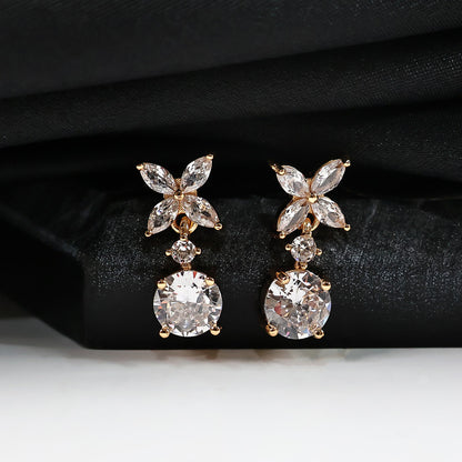 Pair of floral CZ diamond drop earrings showcasing intricate design