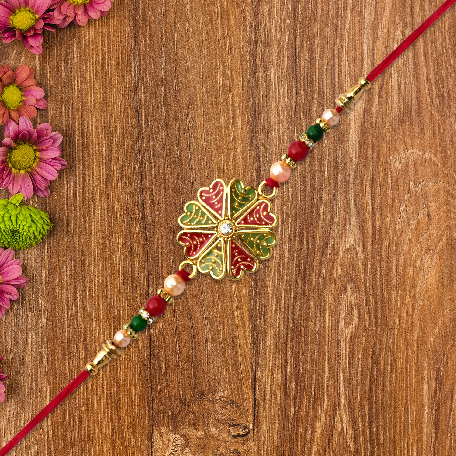 Traditional Rakhi with Bright Floral Centerpiece and Decorative Thread