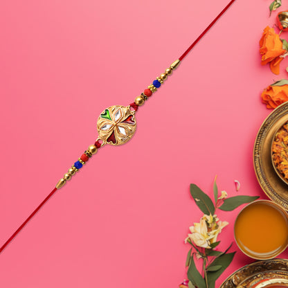 Close-up of floral rakhi with beads and mirror