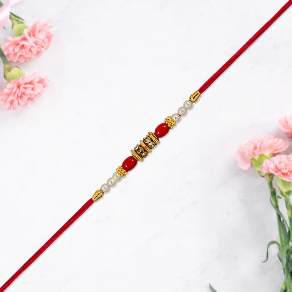 Pearl Beaded Rakhi – Traditional Red & Gold Elegance