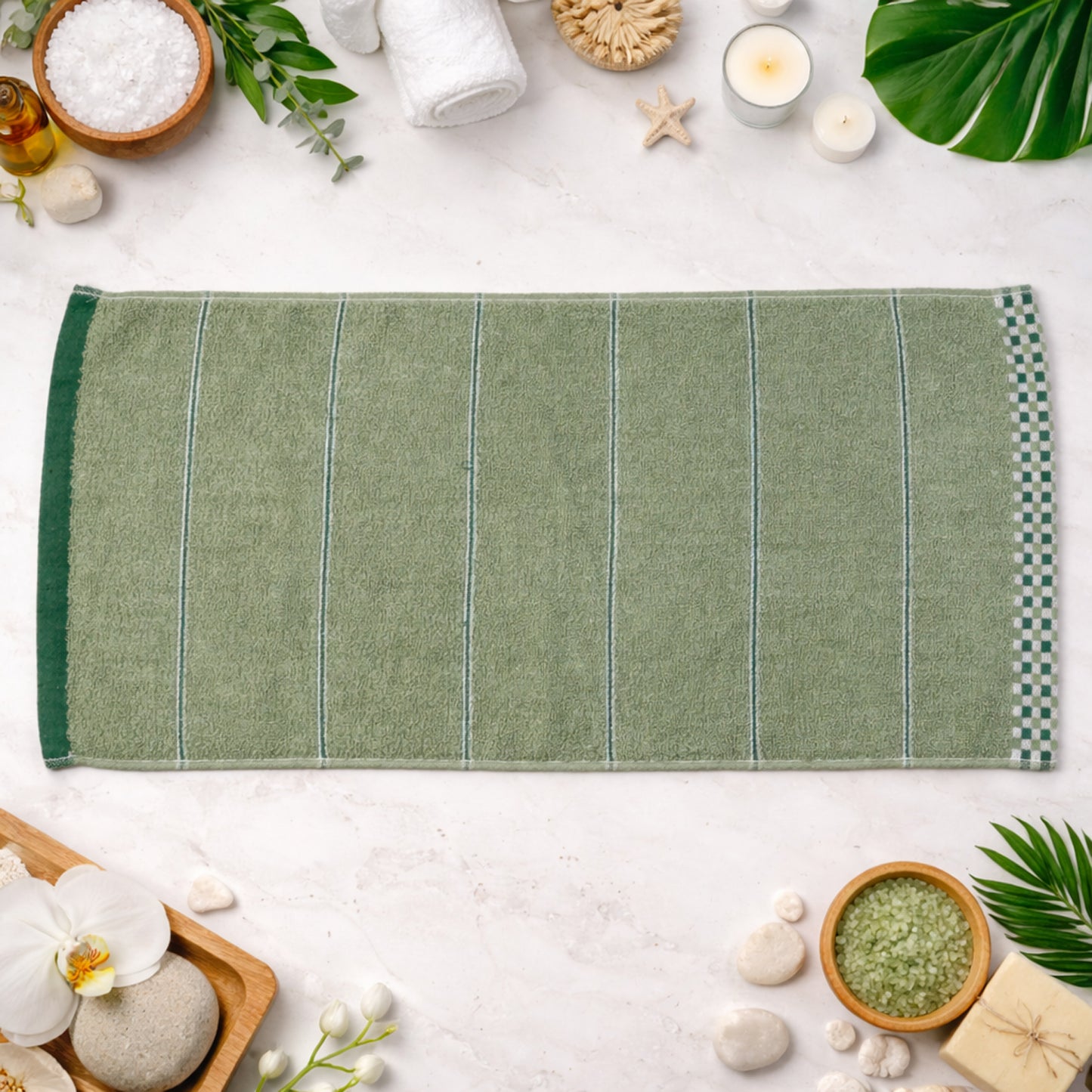 Soft cotton bath towel folded on white background