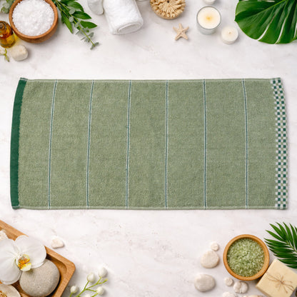 Soft cotton bath towel folded on white background