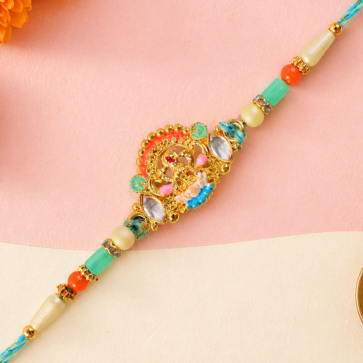 Orange Enamel Floral Kundan Pendant Rakhi with Pastel Beads