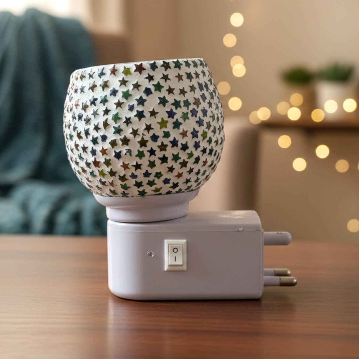 Star pattern mosaic glass night lamp emitting warm ambient light
