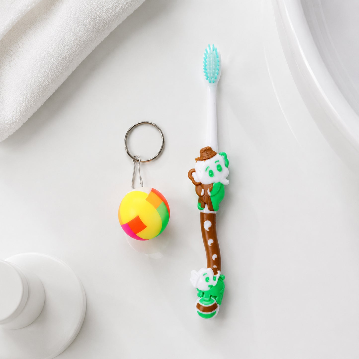 Front view of kids toothbrush and ball toy packaging