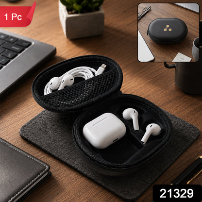 The open black hard shell case displays white earbuds and their charging case, with a coiled cable in a mesh pocket.