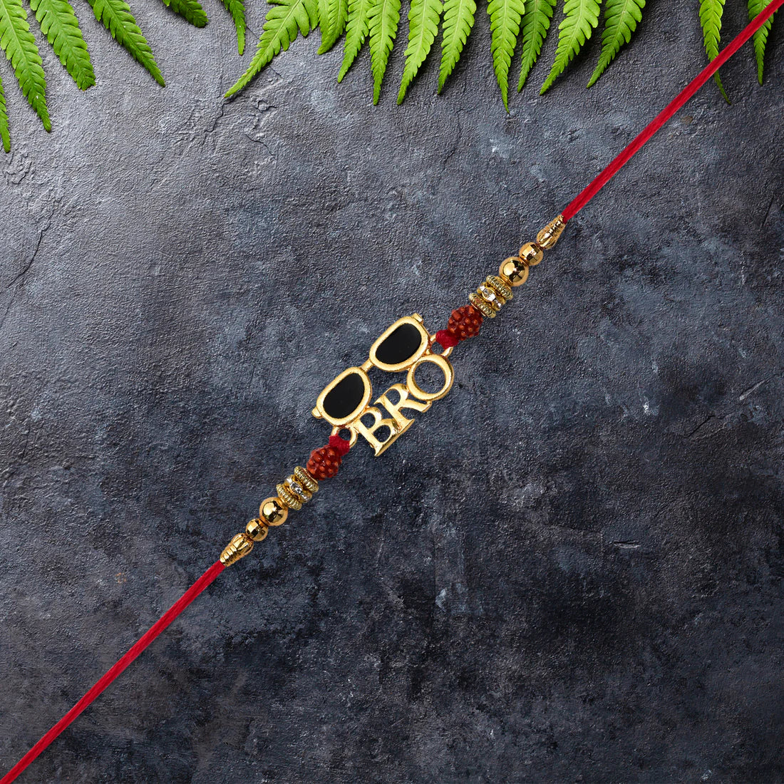 Playful Kids Sunglasses Rakhi tied comfortably on a child's wrist.