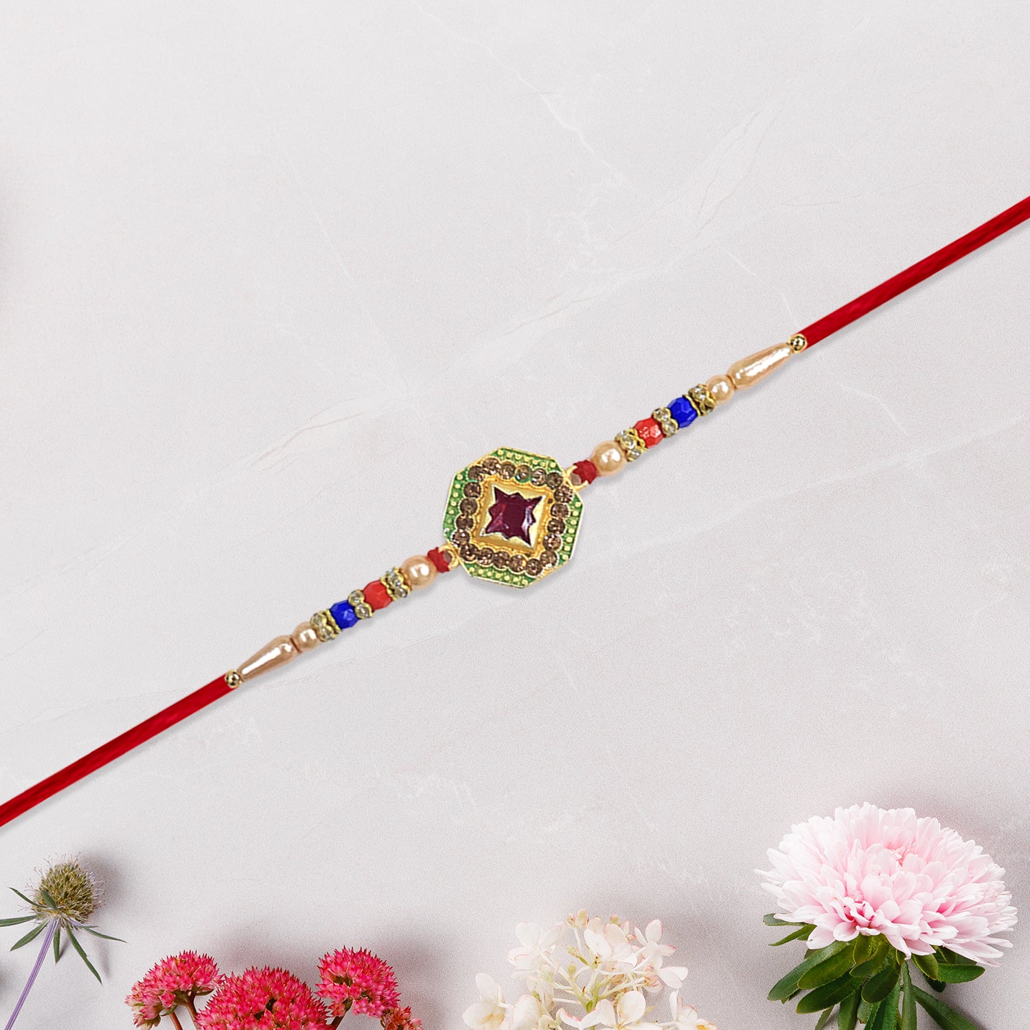 Designer Stone Rakhi with Red Centerpiece, Pearl Beads & Colorful Detailing – Elegant Thread for Raksha Bandhan