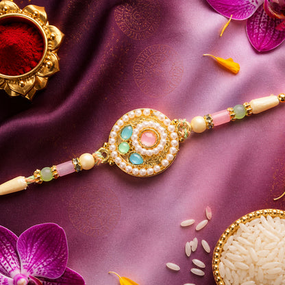 Pearl Bordered Round Pendant Rakhi with Turquoise and Pink Center