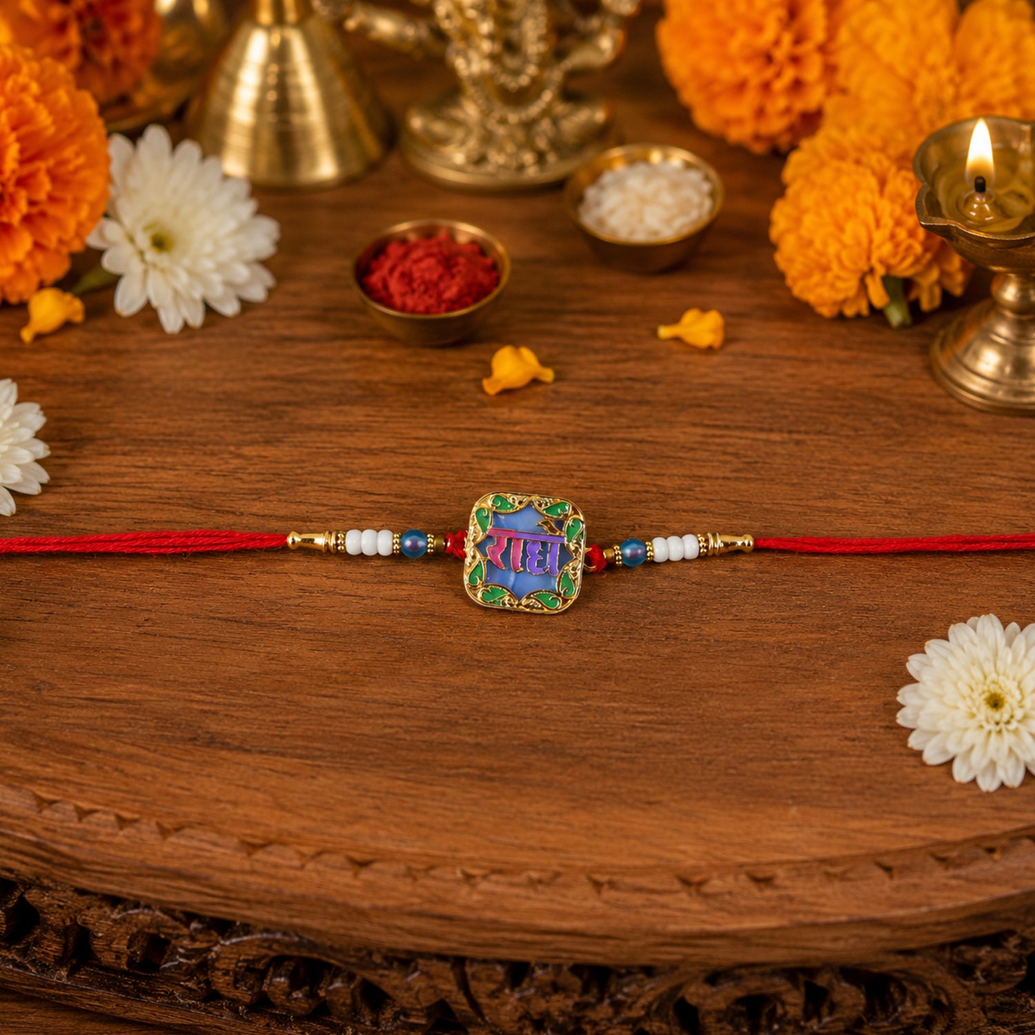 Close-up of Radhe engraved Rakhi with decorative beads