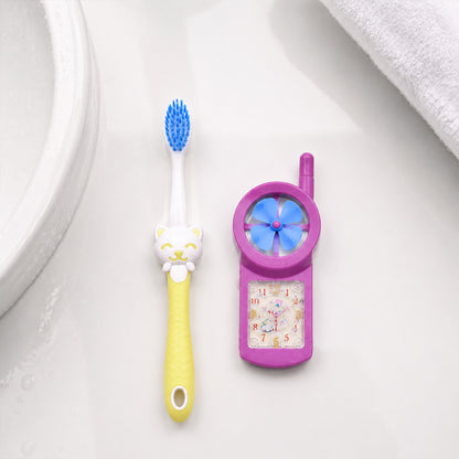 Kids cartoon toothbrush with fan toy held in hand