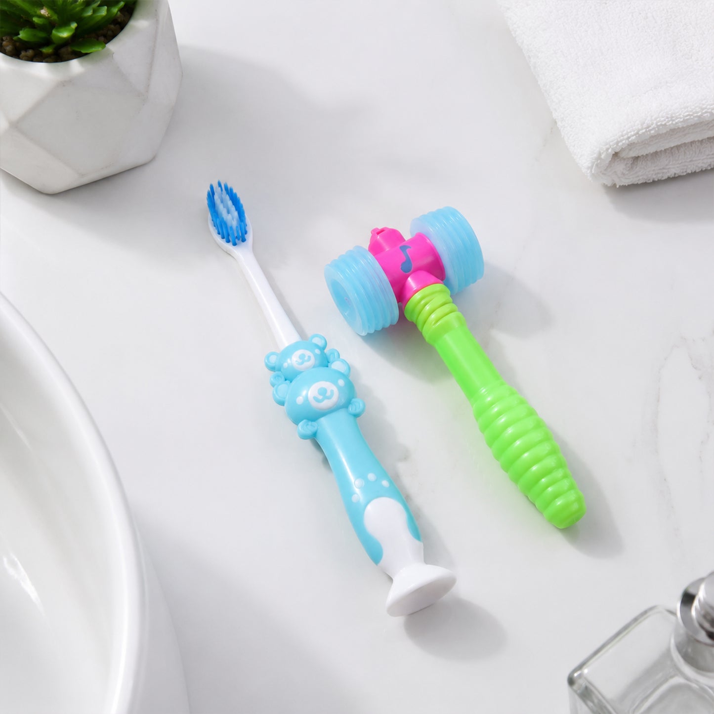 Happy child brushing teeth with the fun hammer toy toothbrush