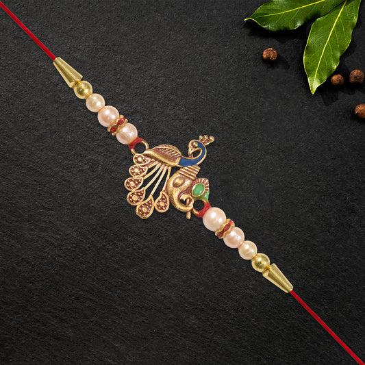 Elegant Peacock Design Rakhi with Pearl Beads and Golden Detailing on Red Thread