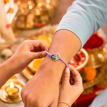 Close-up of peacock motif designer Rakhi