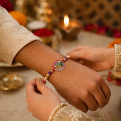 Close-up of Radha Krishna rakhi centerpiece with beads