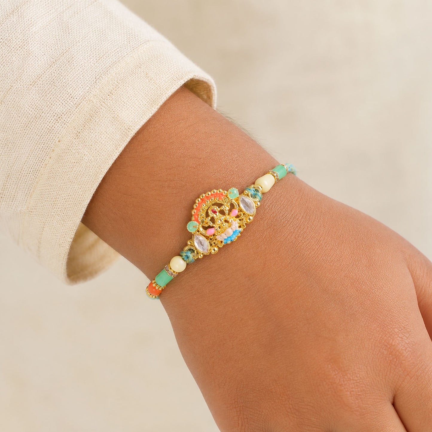 Orange Enamel Floral Kundan Pendant Rakhi with Pastel Beads