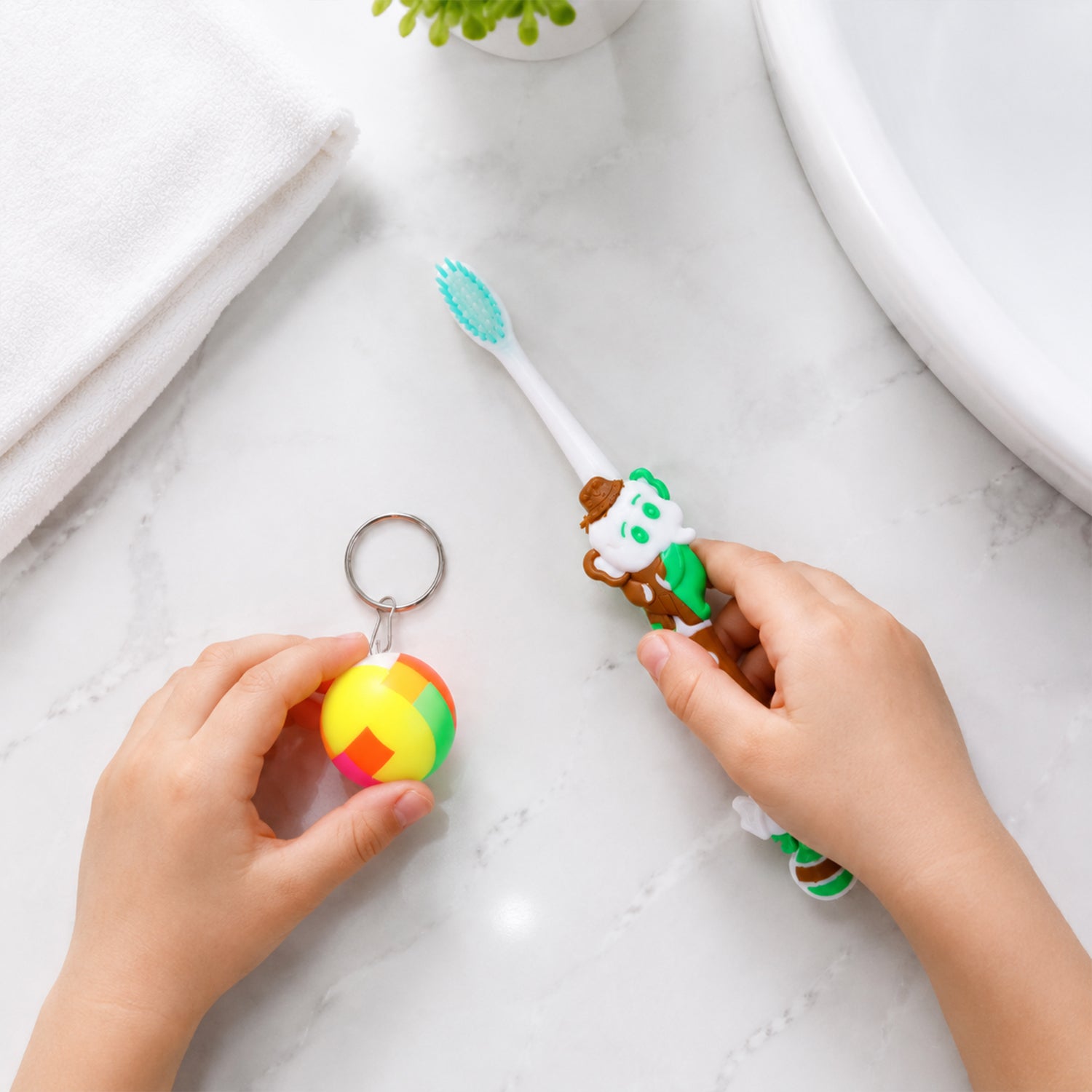 Side view of kids toothbrush and ball toy packaging