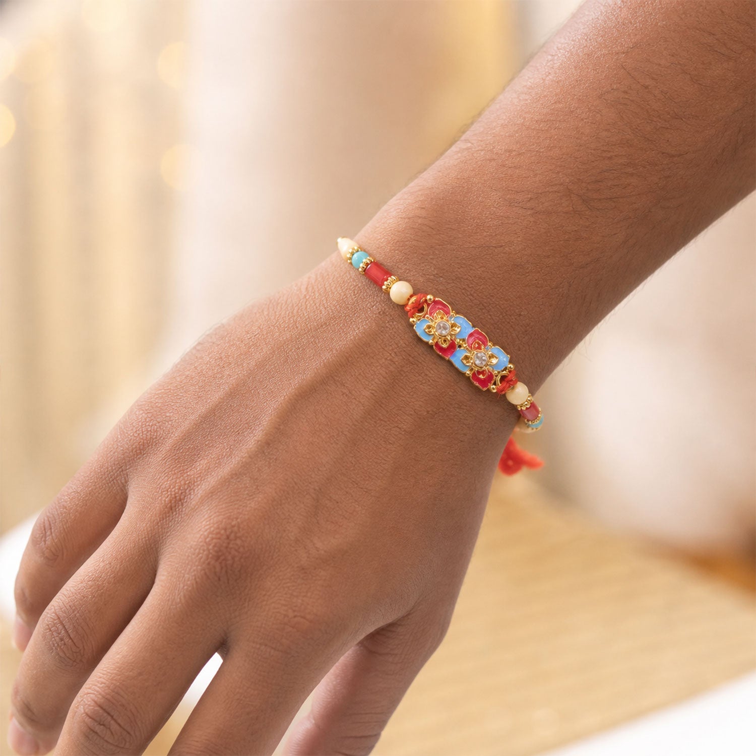 Multicolor Floral Kundan Pendant Rakhi with Red and Blue Beads