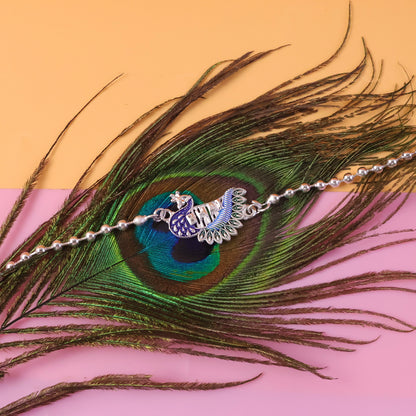 Silver finish Rakhi showing intricate bead details