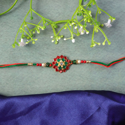 Elaborate Layered Lotus Rakhi Embellished in Red-Green Enamel and a Crystal Core