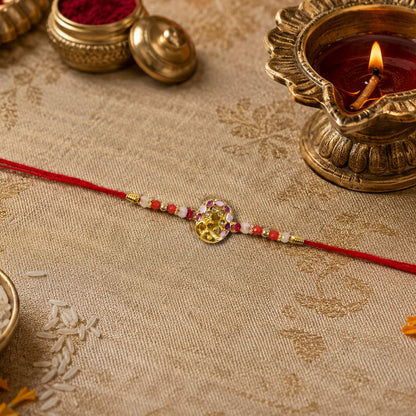 Elegant peacock themed rakhi displaying colorful beads and soft thread