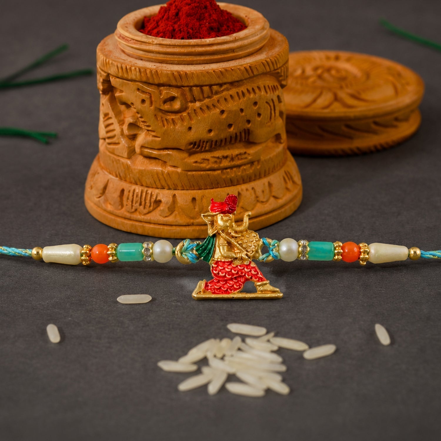 Ganesh Charms Rakhi with Turquoise and Pearl Beads Elegant Festival Accessory (10pcs)