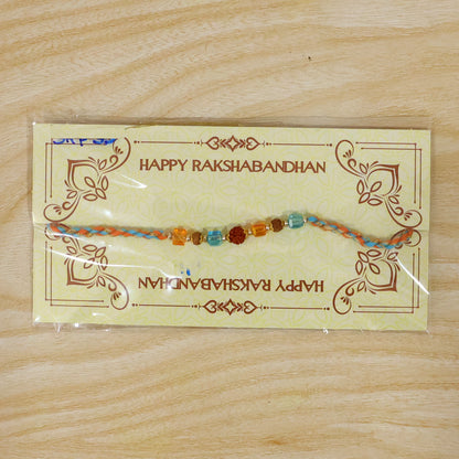 Blue Beaded Bracelet Rakhi with Golden Spacers and Colorful Festive Charm