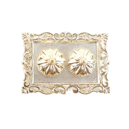 A gold rectangular pooja thali with two flower-shaped containers, on a white background.
