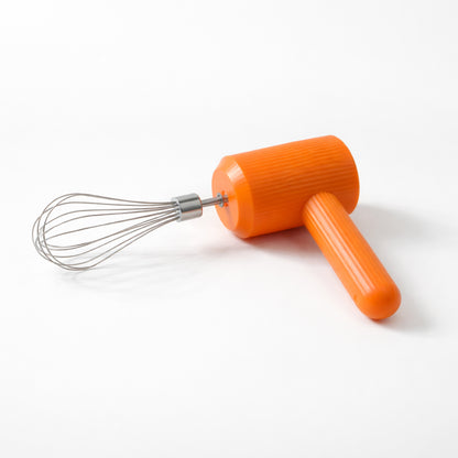 Handheld blender whisk in use