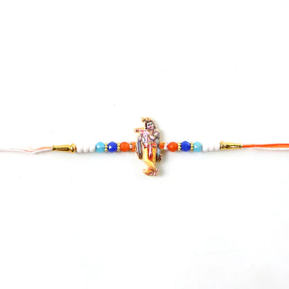 Lord Krishna idol rakhi with decorative beads, perfect for gifting to a brother.