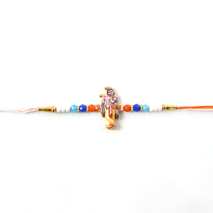 Lord Krishna Rakhi laid flat showing thread and centerpiece
