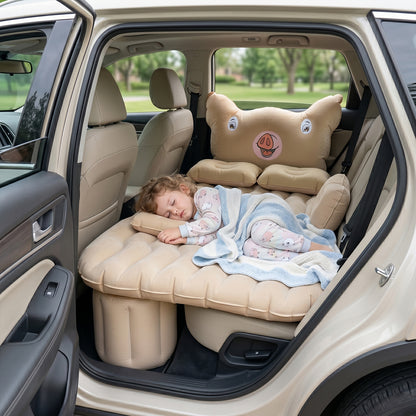Child napping on inflatable car air mattress with pig pillow