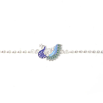 Hand tying silver peacock design Rakhi with beaded thread