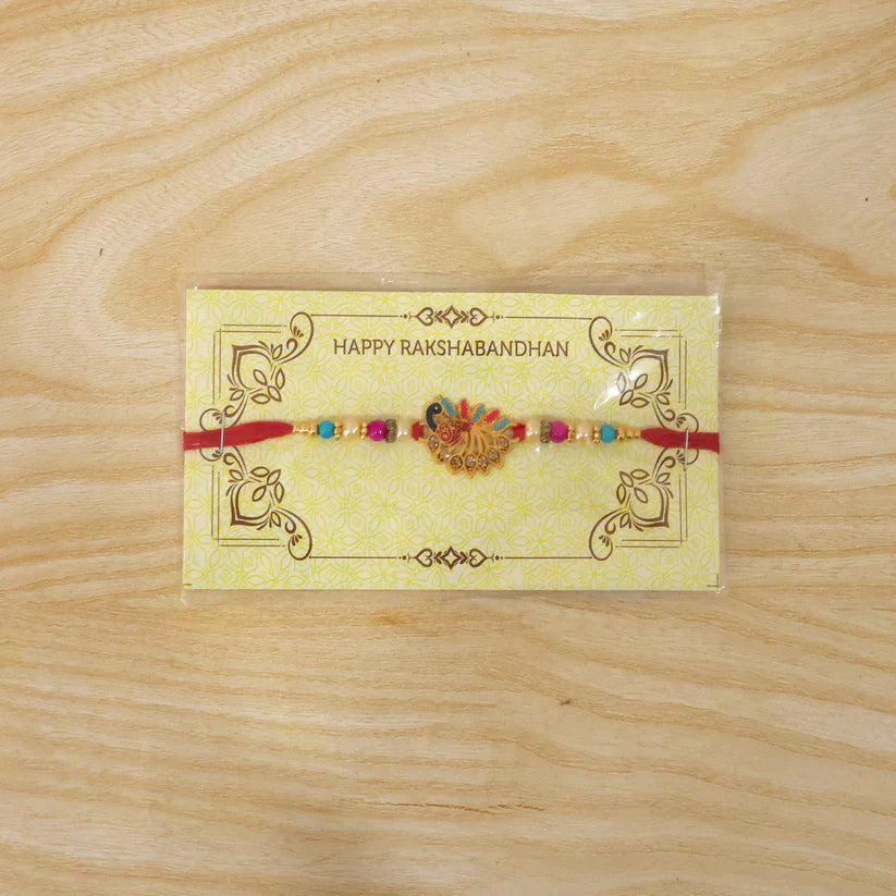 Peacock Rakhi – Colourful Stone Detailing & Red Thread