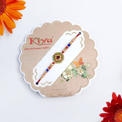 Designer Stone Rakhi with Red Centerpiece, Pearl Beads & Colorful Detailing – Elegant Thread for Raksha Bandhan