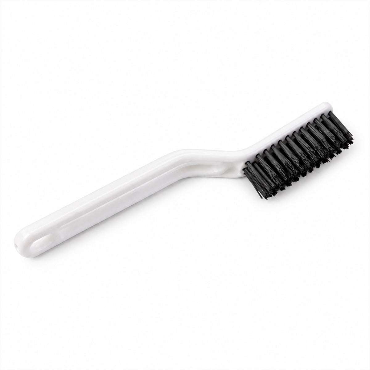 A white plastic cleaning brush with black bristles is isolated on a clean white background.