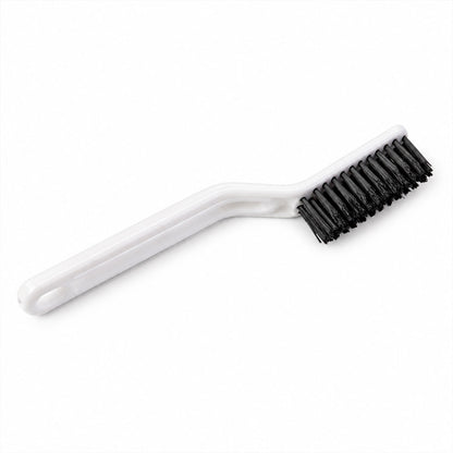 A white plastic cleaning brush with black bristles is isolated on a clean white background.