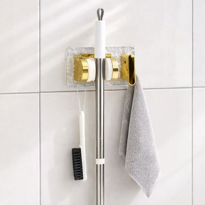 Space saving broom and mop hanger
