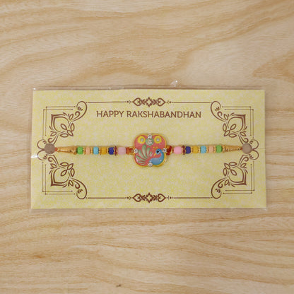 Elegant peacock motif on designer Rakhi for Raksha Bandhan