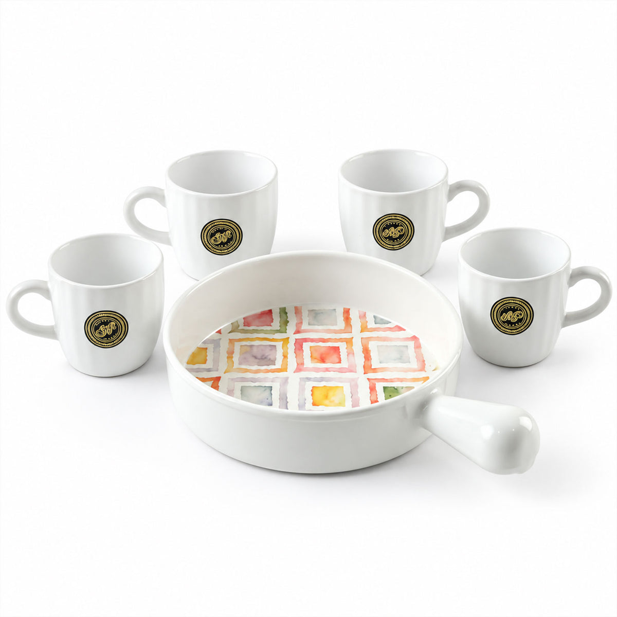 A white ceramic platter with a colorful square pattern is centered, surrounded by four matching white mugs on a plain